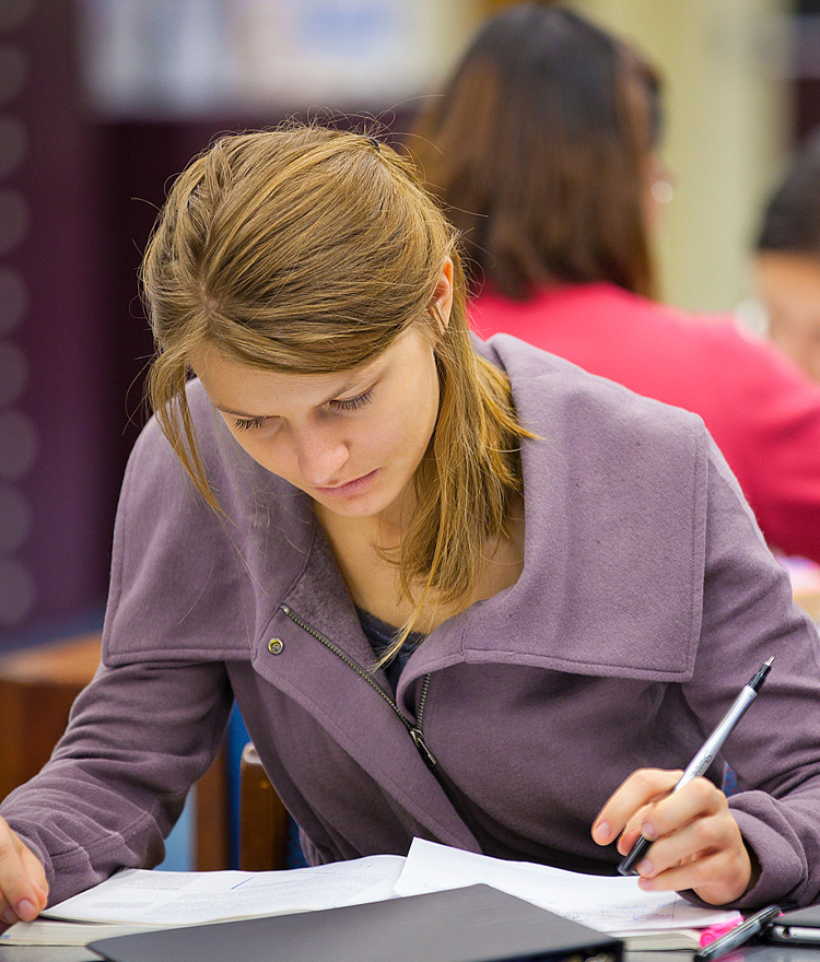 Student studying paper.